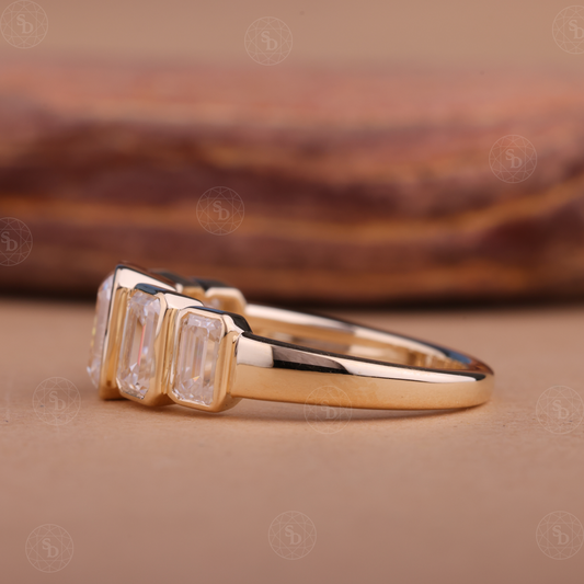 14K yellow gold wedding band with graduating emerald cut lab-grown diamonds