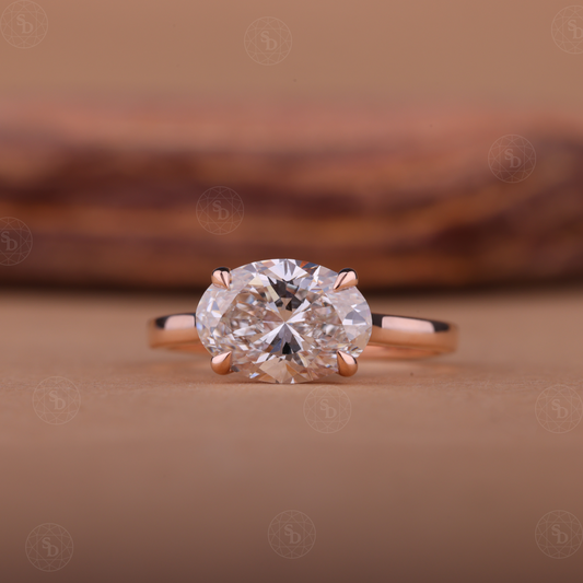 Oval lab-grown diamond engagement ring with east-west solitaire setting in gold