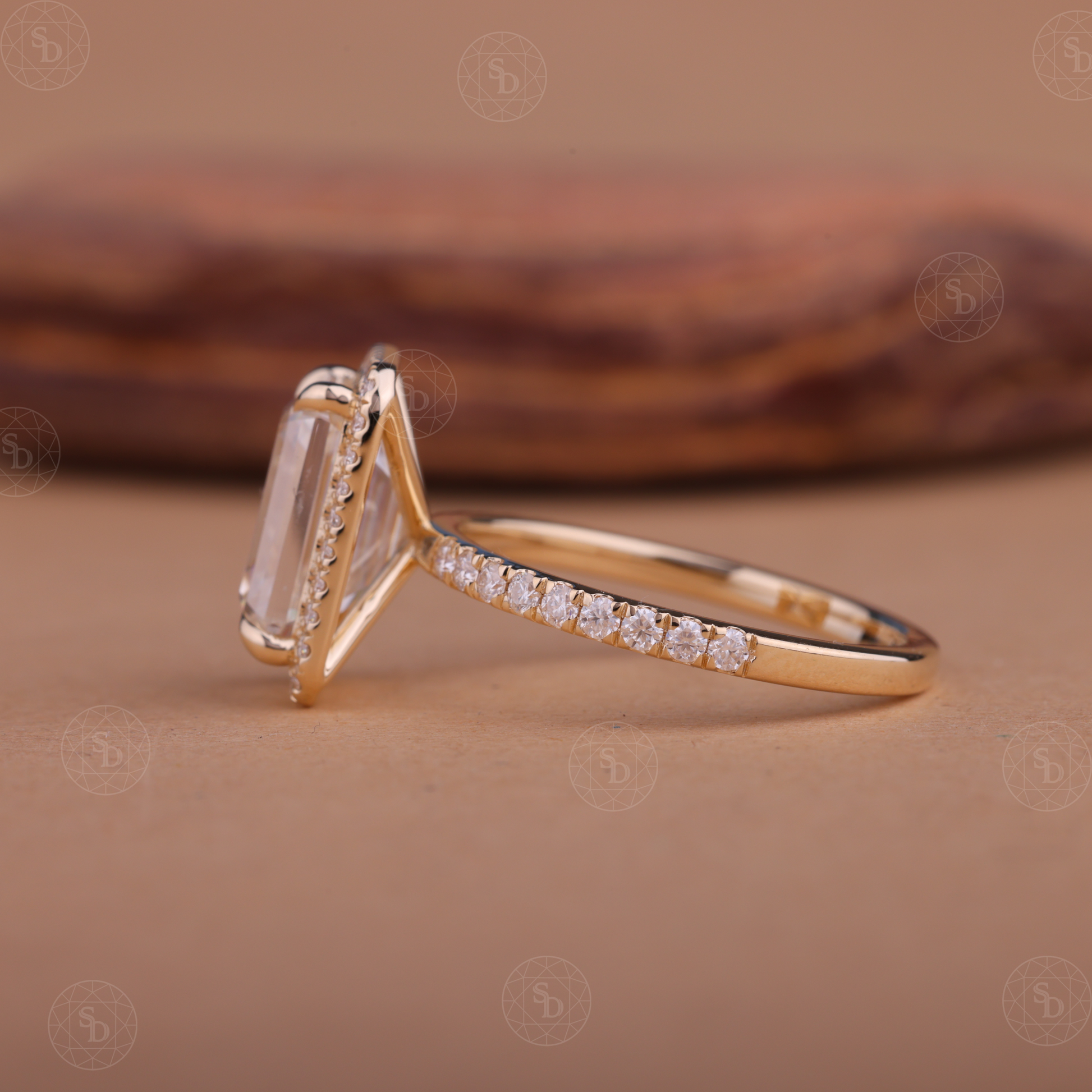 Emerald cut lab-grown diamond halo engagement ring in 14K gold with a sparkling halo setting