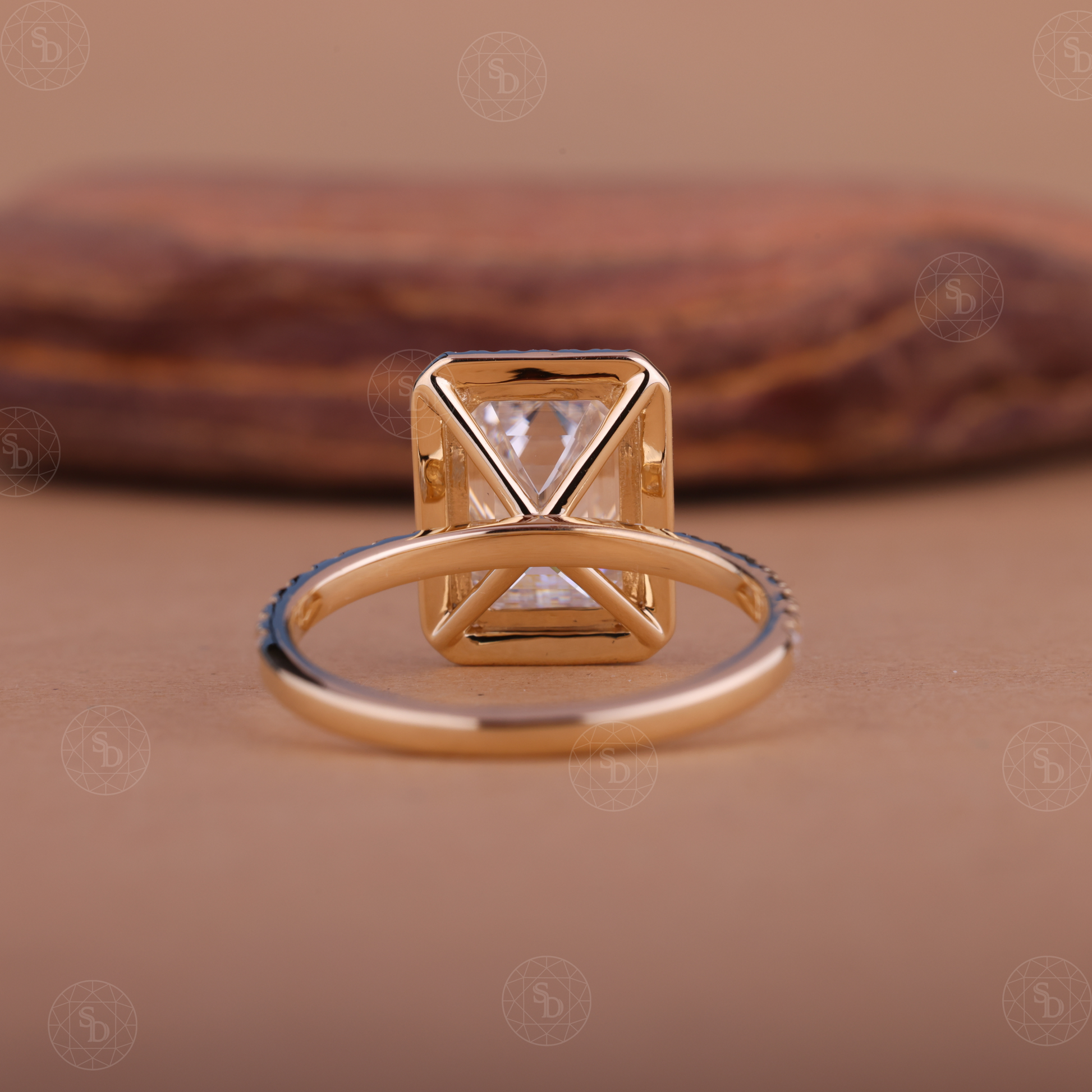 Emerald cut lab-grown diamond halo engagement ring in 14K gold with a sparkling halo setting