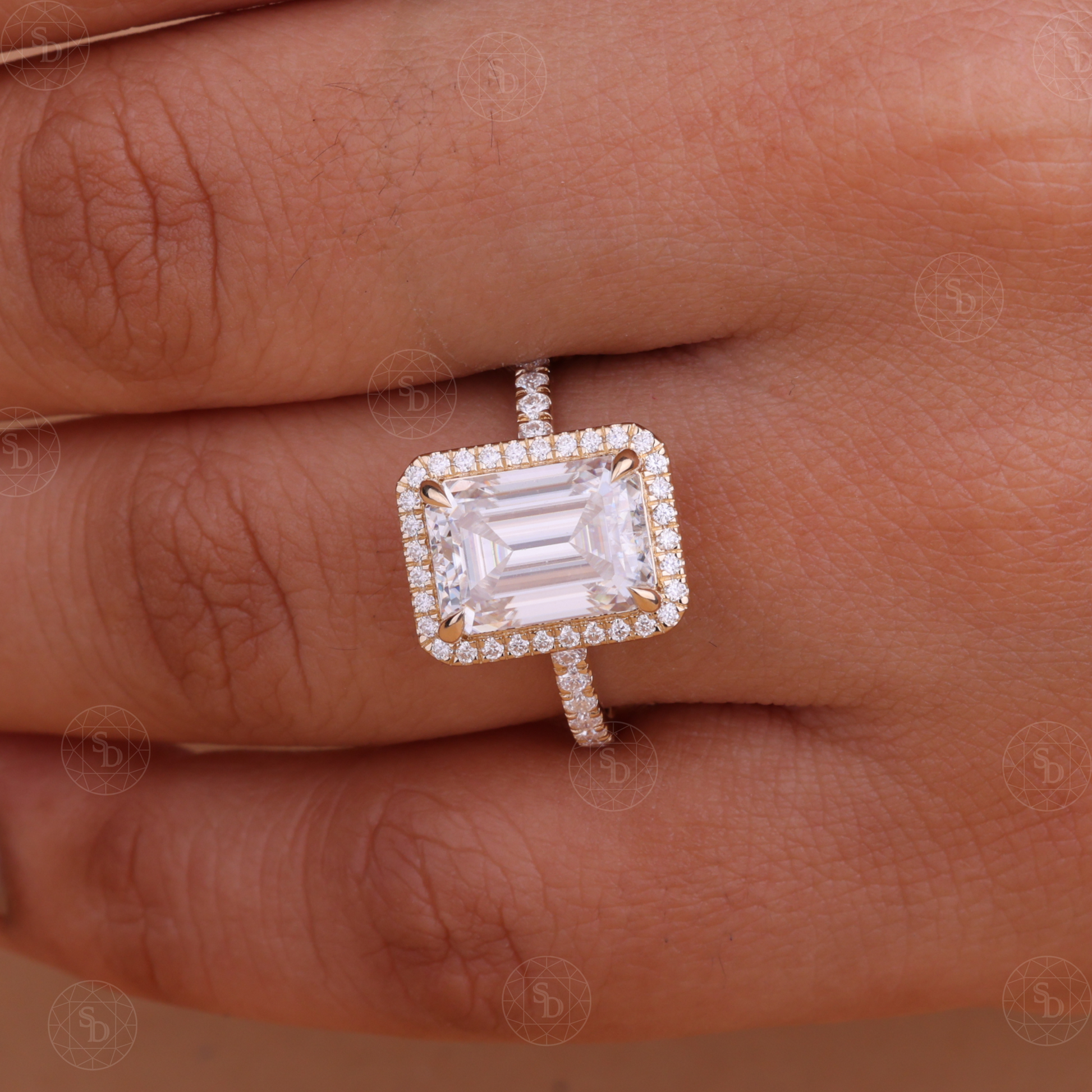 Emerald cut lab-grown diamond halo engagement ring in 14K gold with a sparkling halo setting