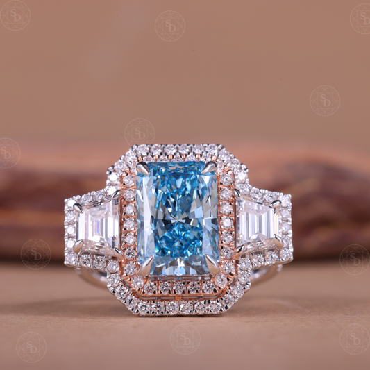 Two-tone gold engagement ring with fancy blue radiant cut lab diamond and double halo
