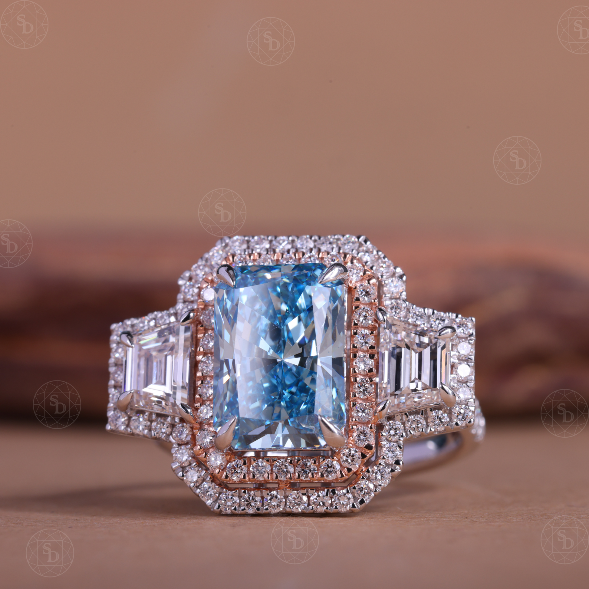 Two-tone gold engagement ring with fancy blue radiant cut lab diamond and double halo