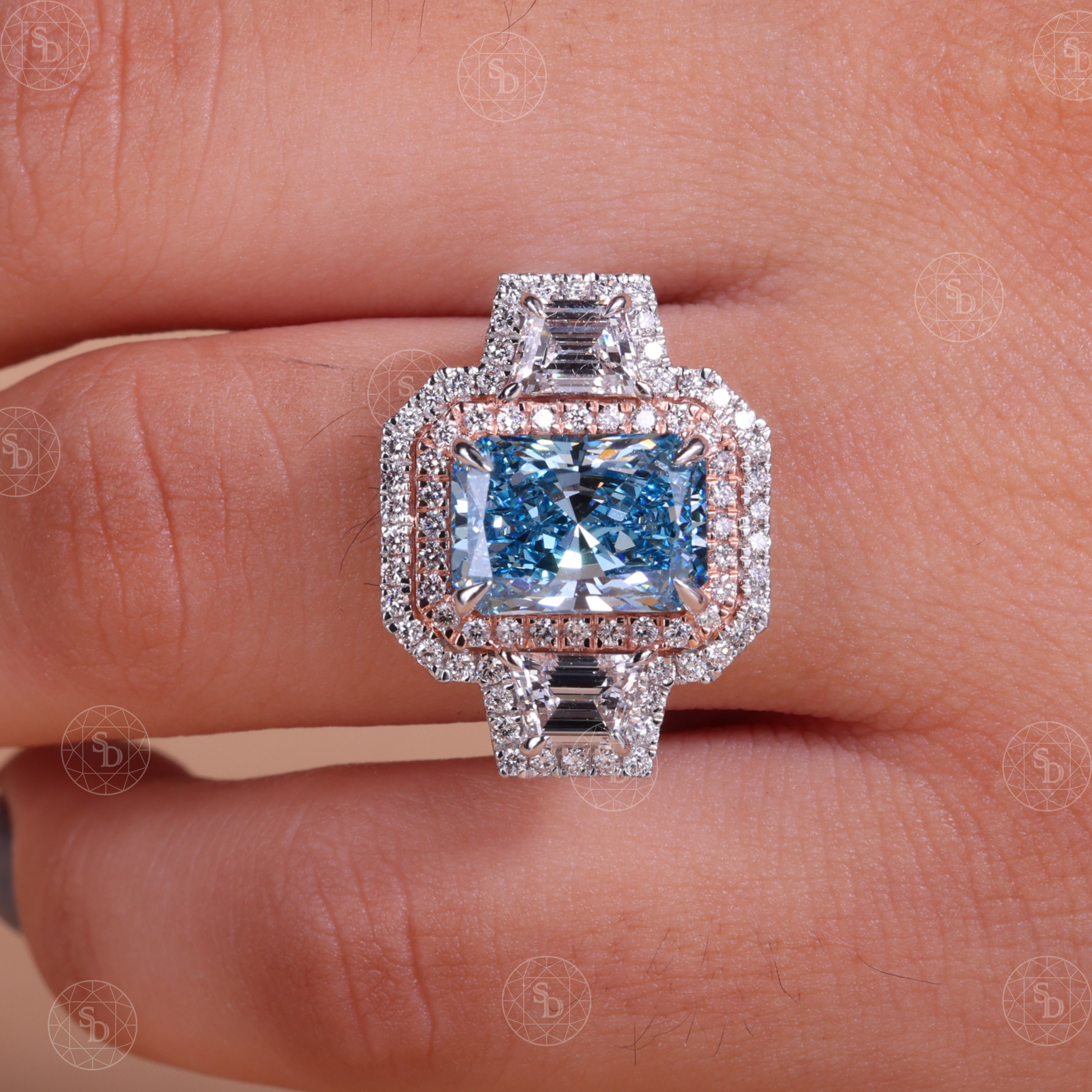 Two-tone gold engagement ring with fancy blue radiant cut lab diamond and double halo