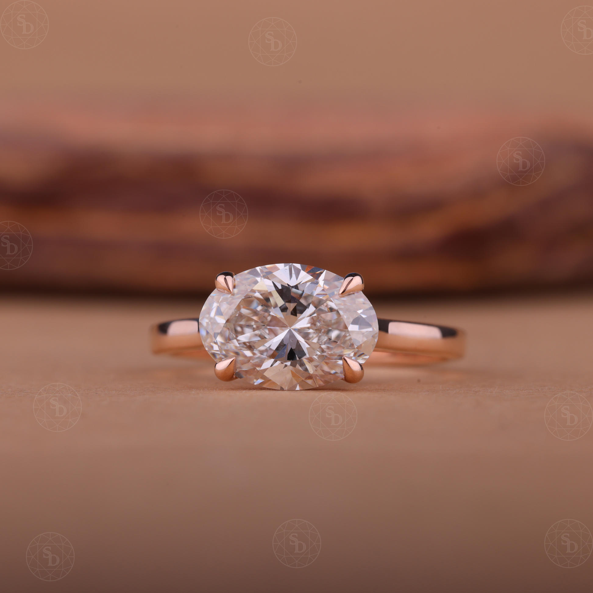 Oval lab-grown diamond engagement ring with east-west solitaire setting in gold