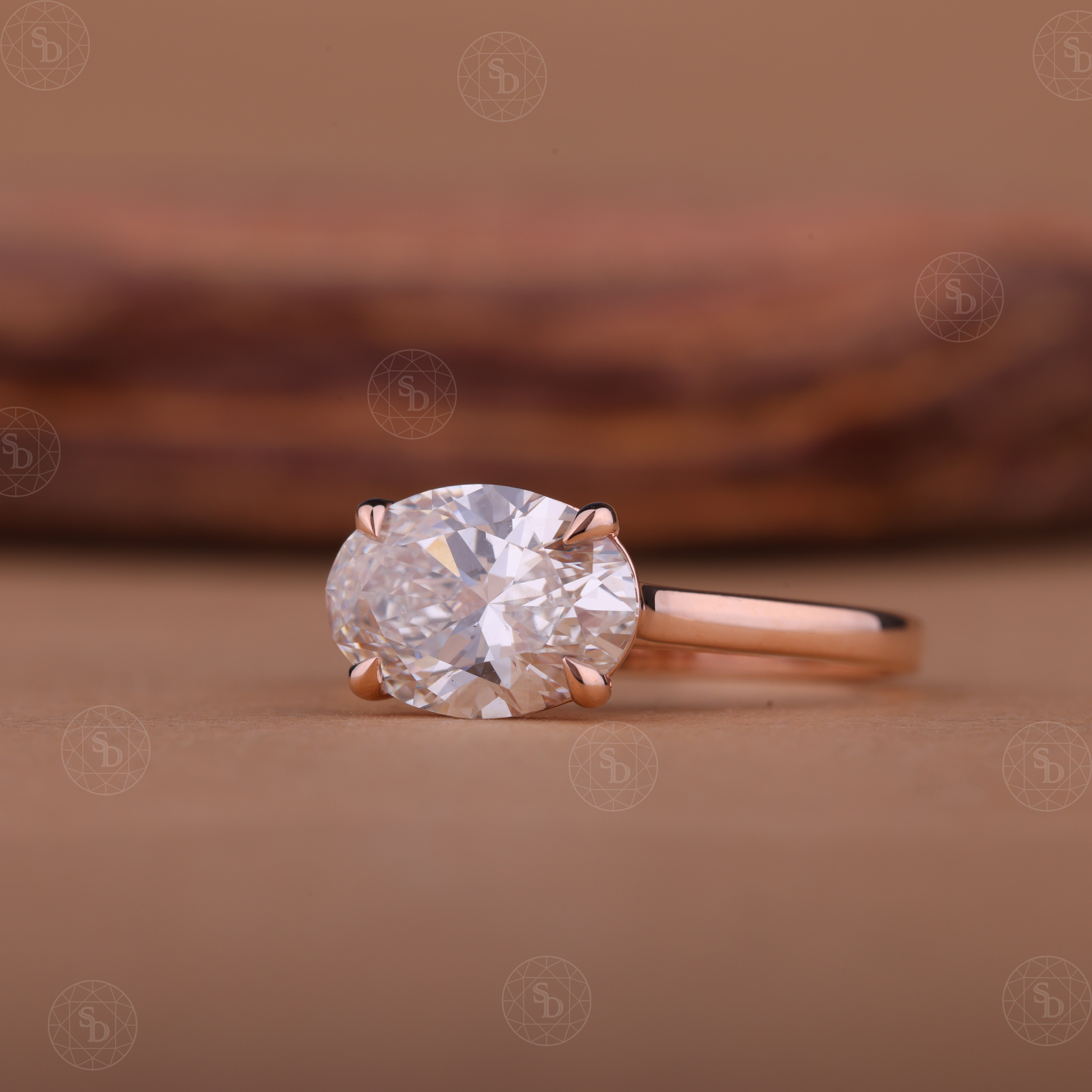 Oval lab-grown diamond engagement ring with east-west solitaire setting in gold