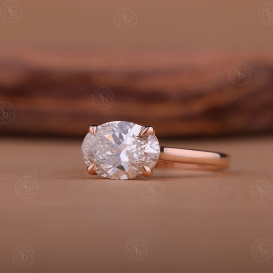 Oval lab-grown diamond engagement ring with east-west solitaire setting in gold
