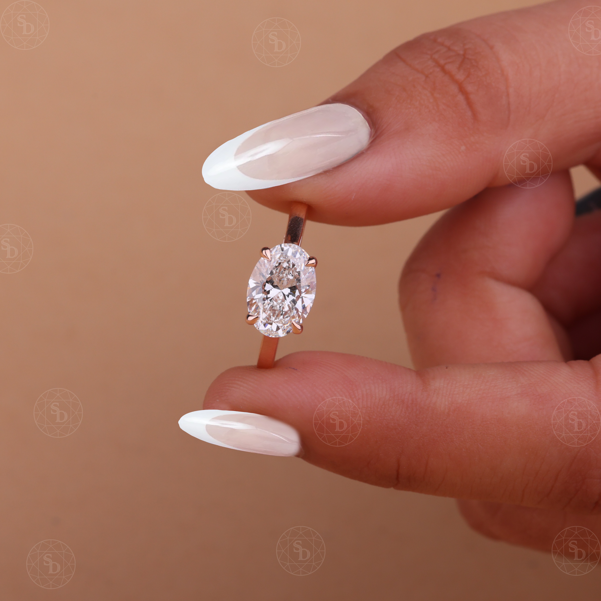 Oval lab-grown diamond engagement ring with east-west solitaire setting in gold
