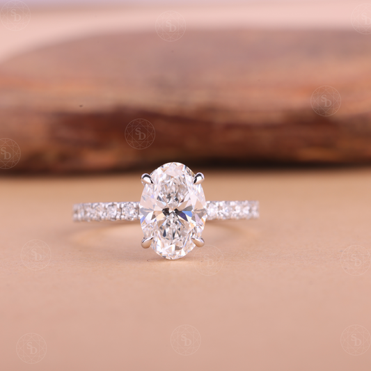 Oval lab-grown diamond engagement ring in solid gold with IGI certified VVS2 diamonds, elegant eternity band design, sustainable fine jewelry for women.