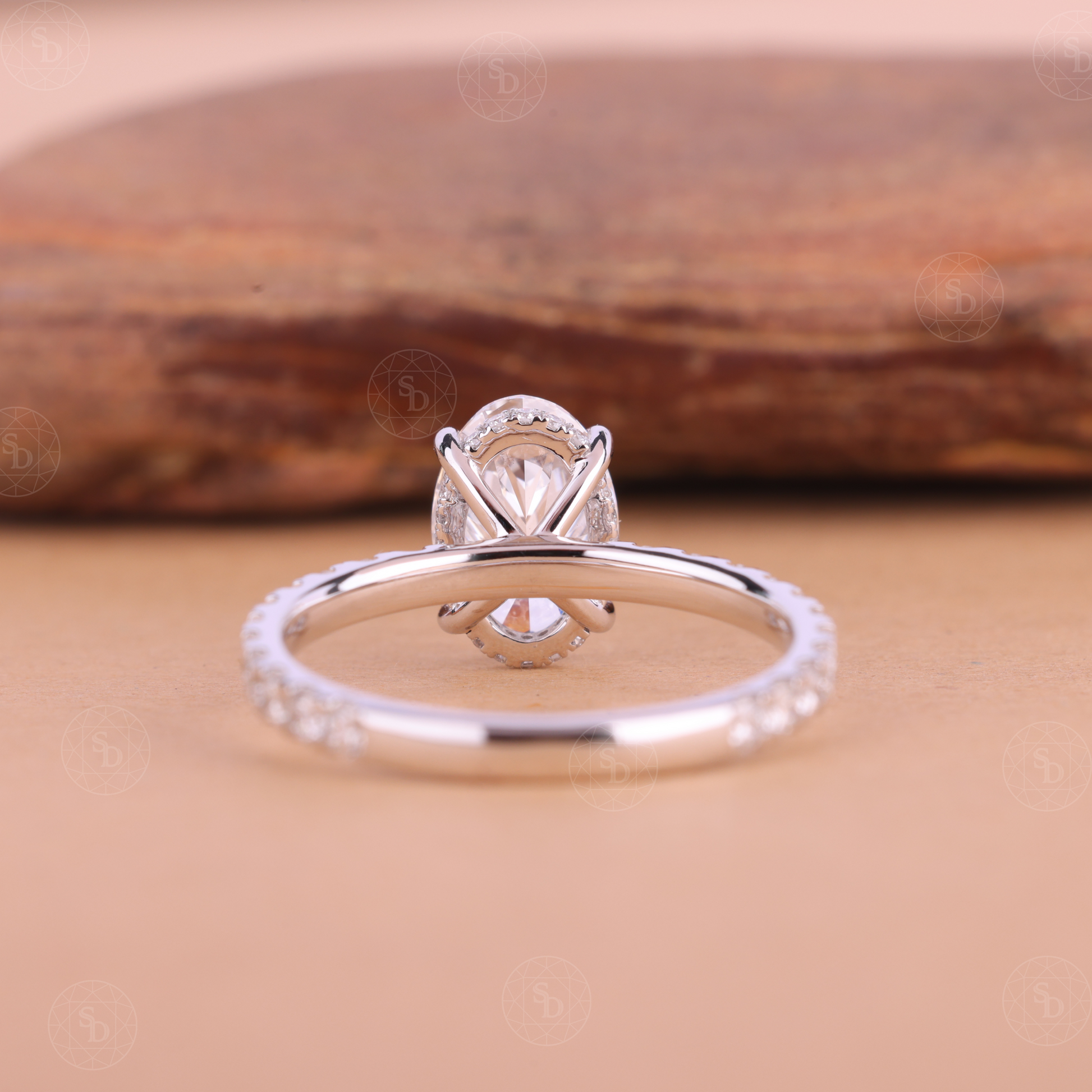 Oval lab-grown diamond engagement ring in solid gold with IGI certified VVS2 diamonds, elegant eternity band design, sustainable fine jewelry for women.