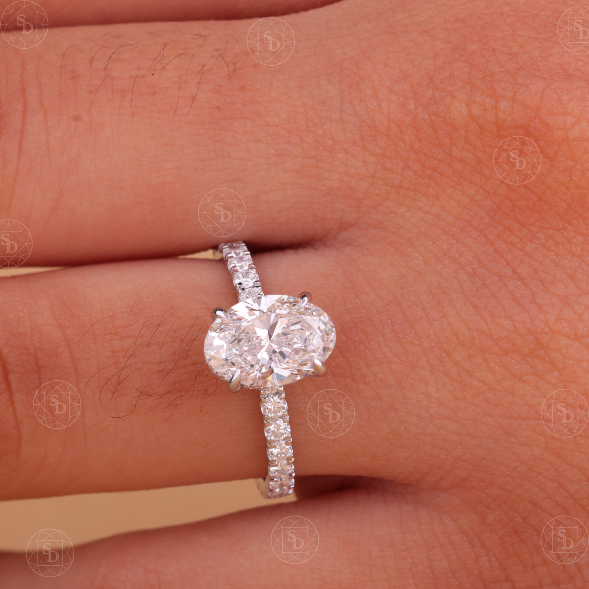 Oval lab-grown diamond engagement ring in solid gold with IGI certified VVS2 diamonds, elegant eternity band design, sustainable fine jewelry for women.