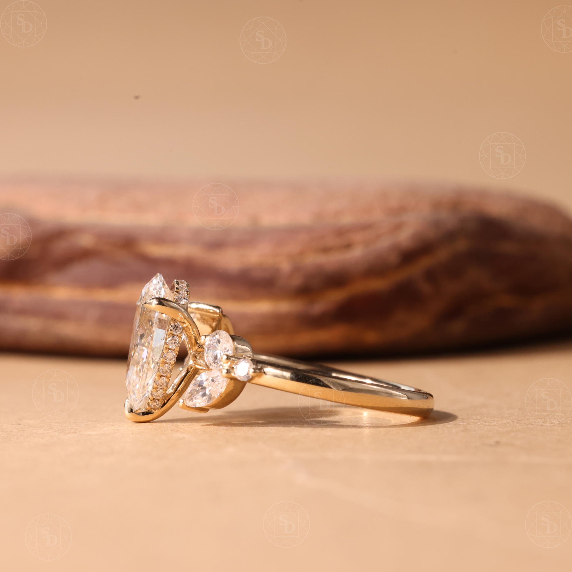 Nature Inspired Pear cut lab diamond engagement ring in 14K gold with hidden halo and marquise round side stones