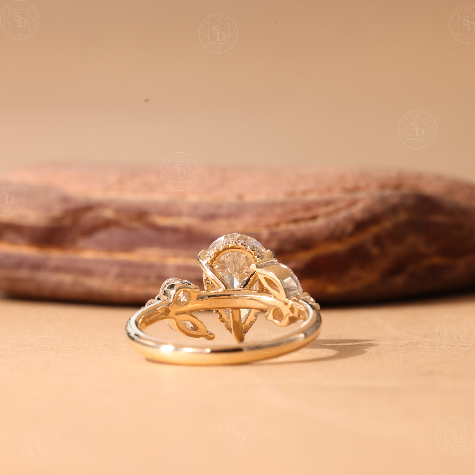 Nature Inspired Pear cut lab diamond engagement ring in 14K gold with hidden halo and marquise round side stones