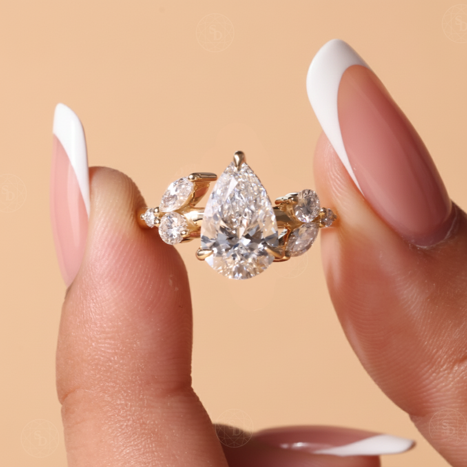 Nature Inspired Pear cut lab diamond engagement ring in 14K gold with hidden halo and marquise round side stones