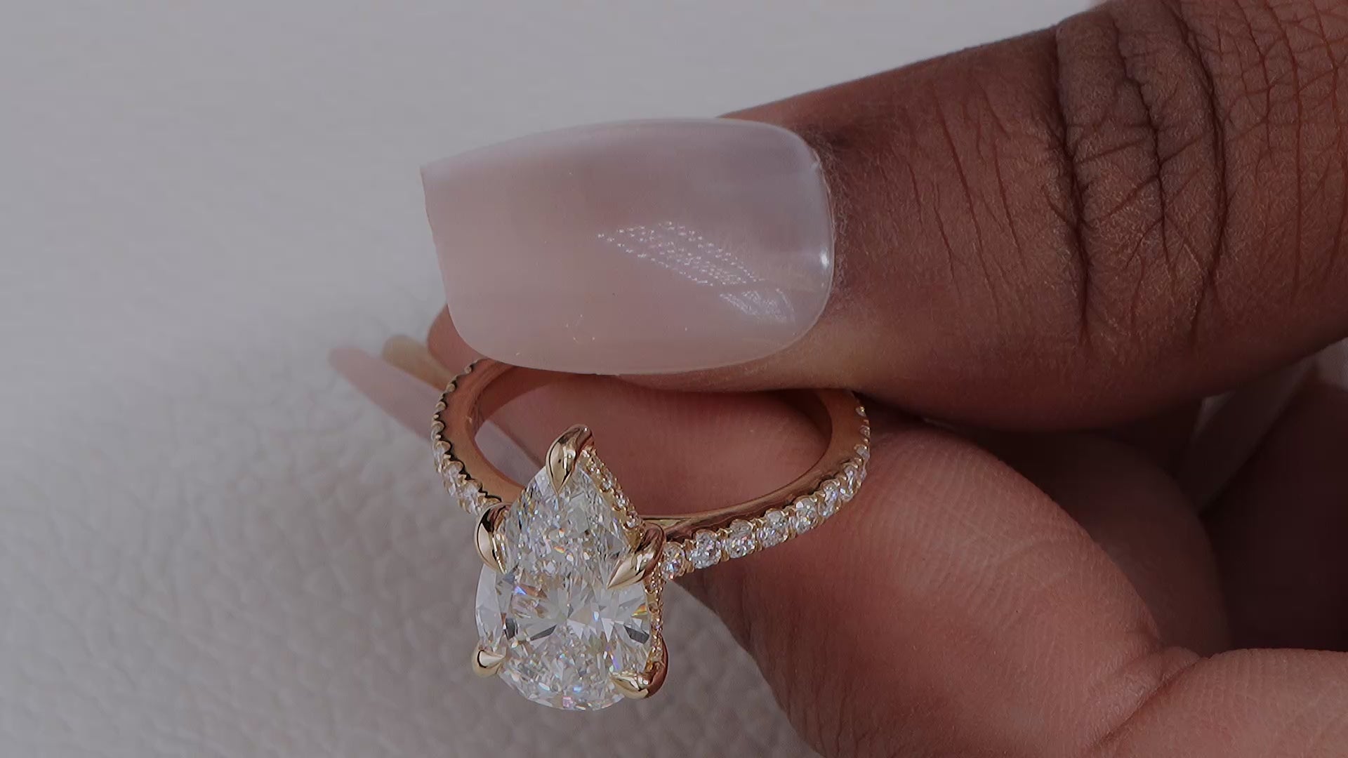 Pear Cut Lab Diamond Cathedral set ring with pave diamond and hidden halo