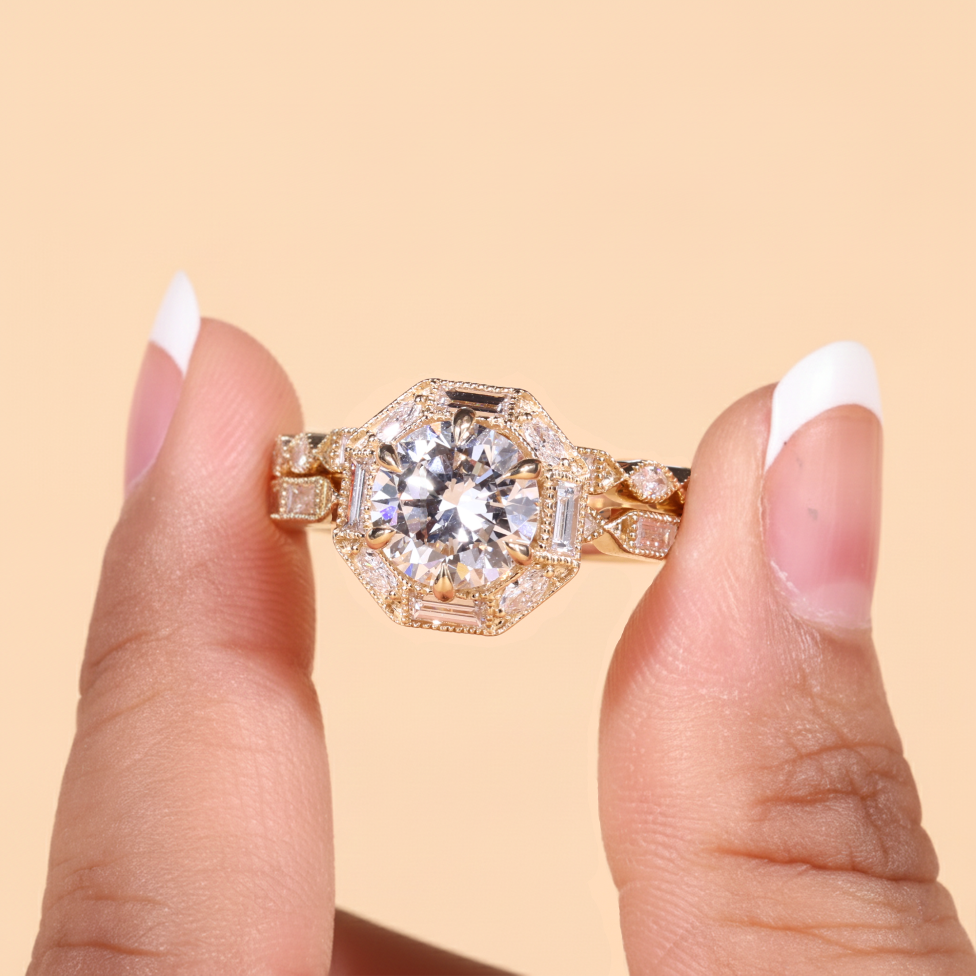 Vintage round cut lab-grown diamond engagement ring set with baguette and marquise halo, milgrain detailing, and elegant antique-inspired design in solid gold